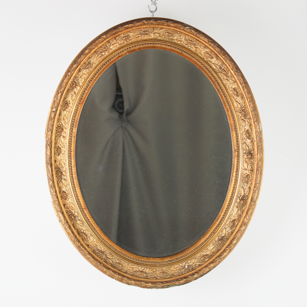Specchio ovale con cornice in legno dorata d'epoca 1800