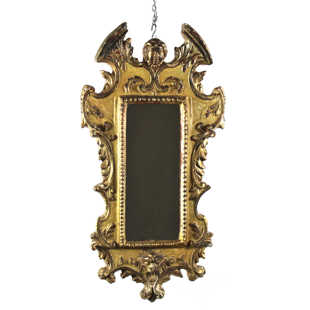 Antico specchio in stile barocco con testa d'angelo