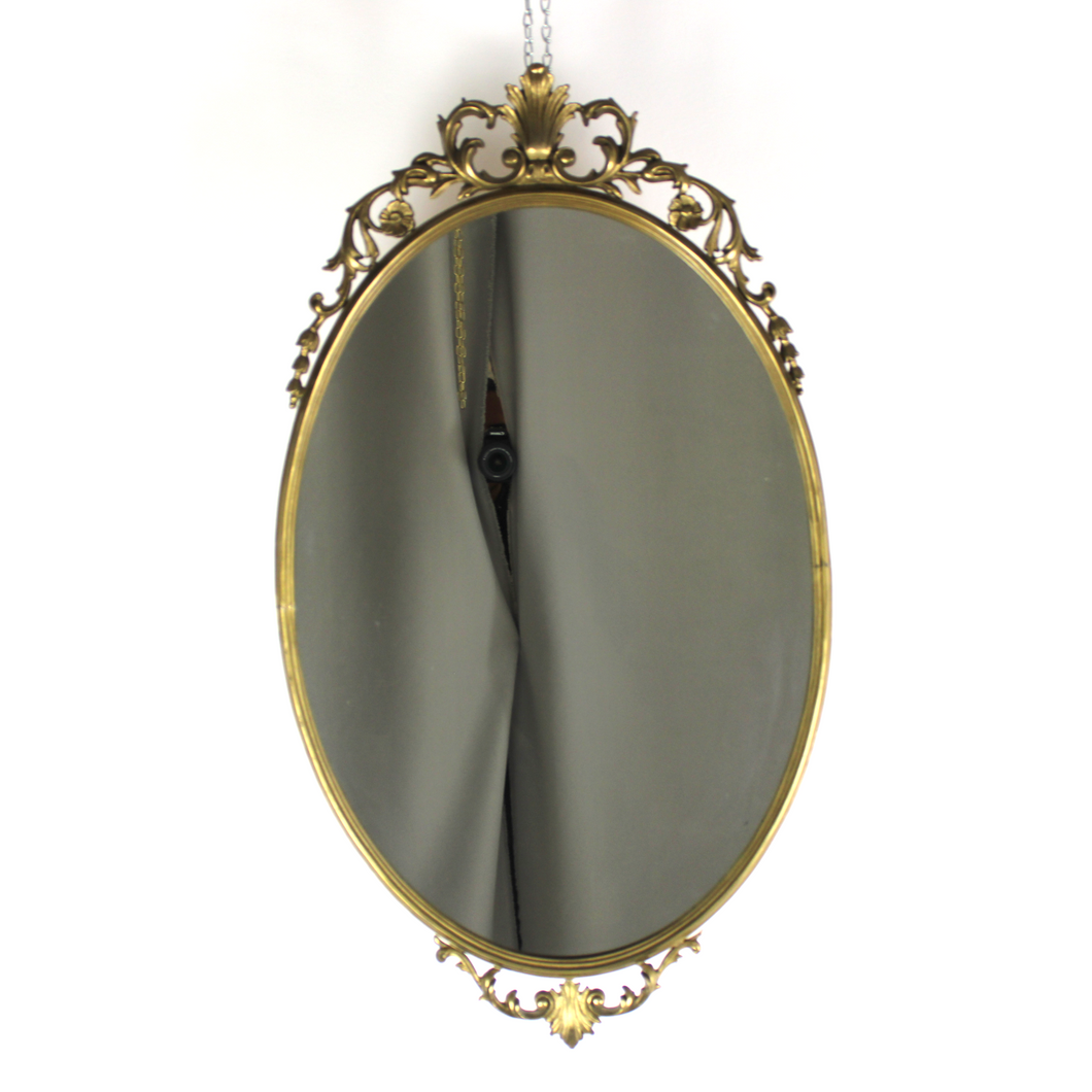 Specchio ovale in ottone